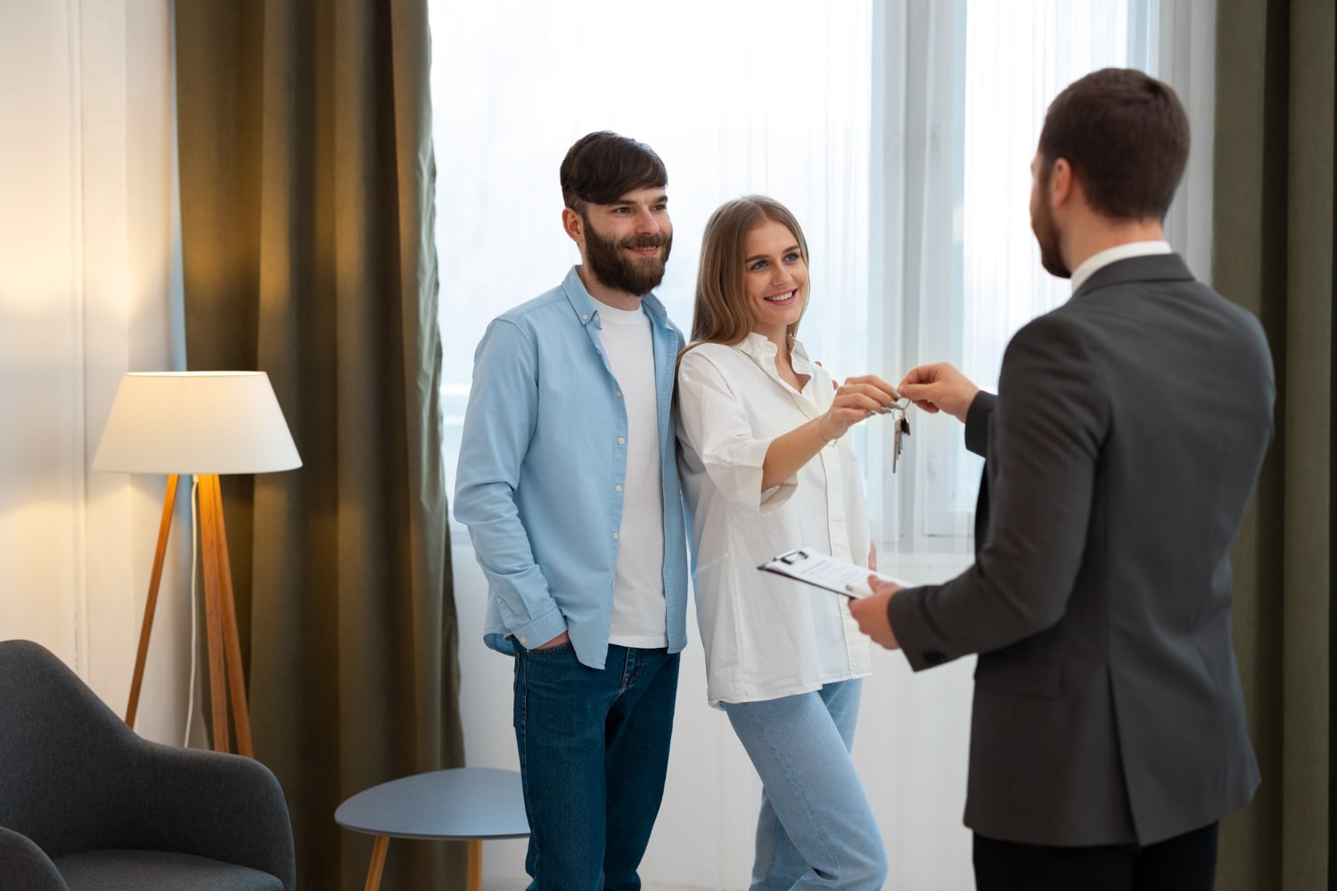 agent doing business and showing house to potential buying couple