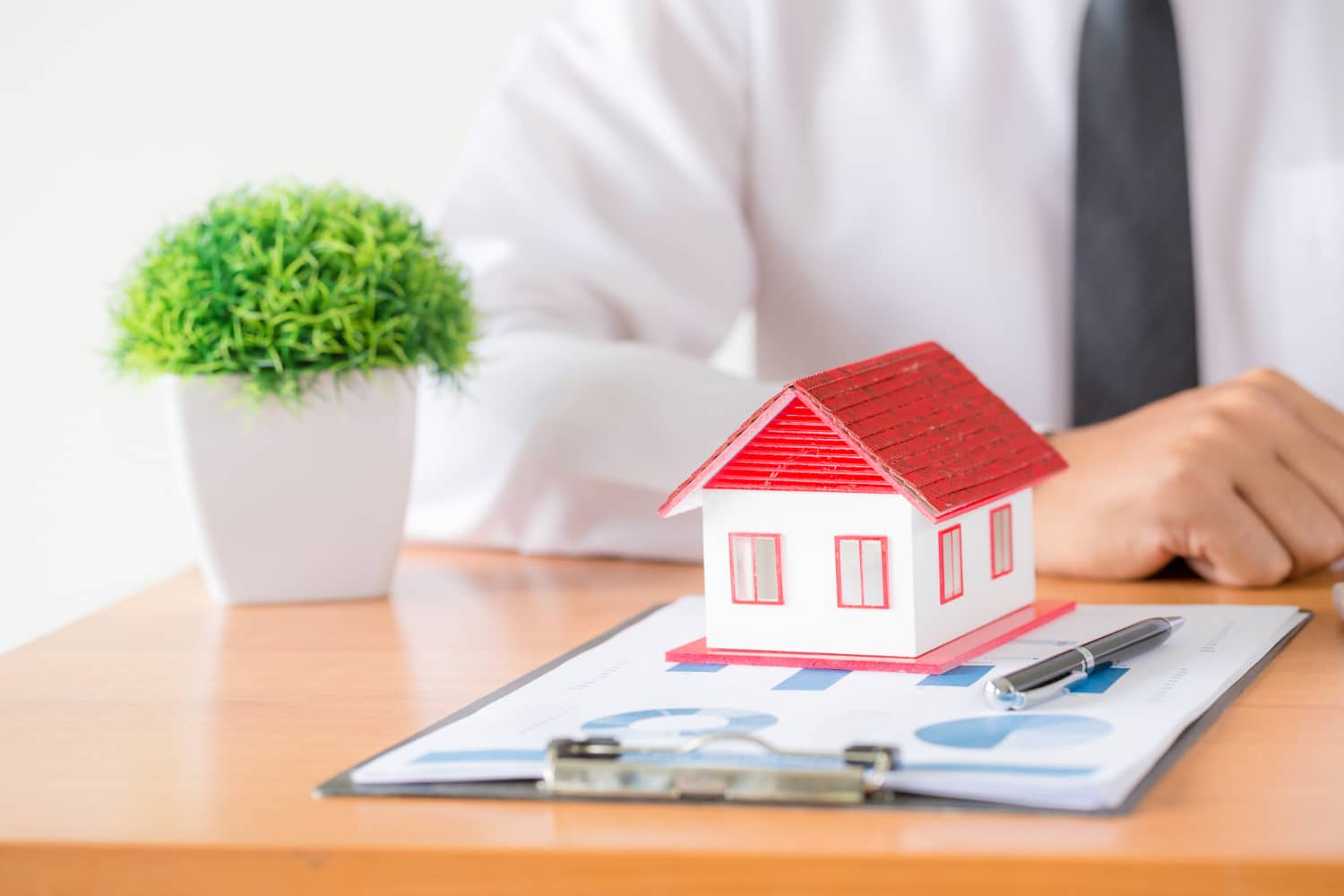 mortgage broker with house model