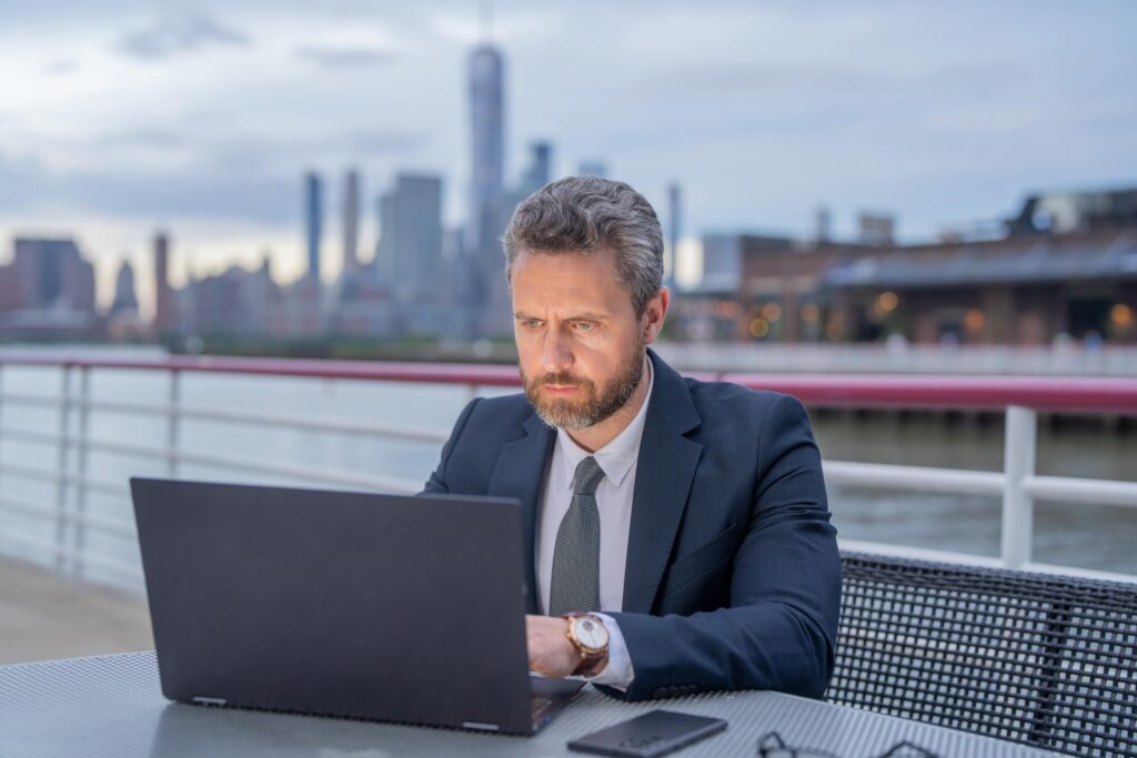Professional working on his laptop in London. Contractor mortgages.