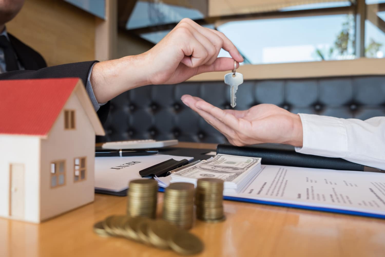 agent giving house key customer sign agreement property
